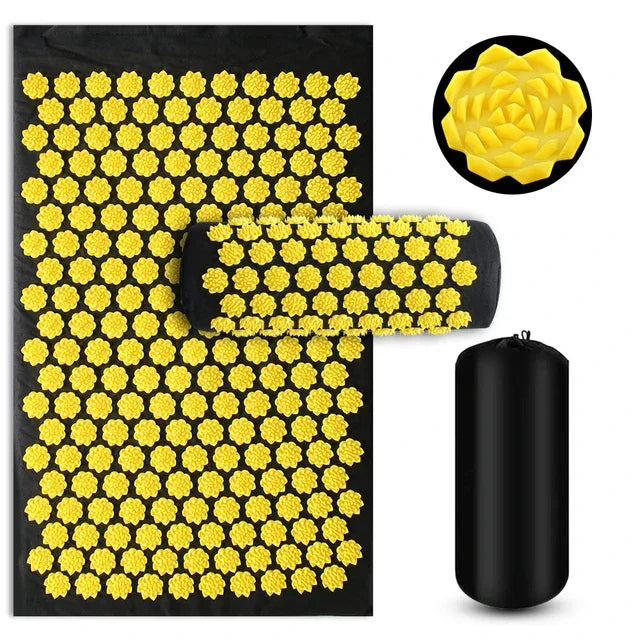 Black acupressure mat set with yellow lotus-shaped spikes, pillow, and storage bag