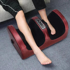Person using electric foot massager with control panel, relaxation and wellness device